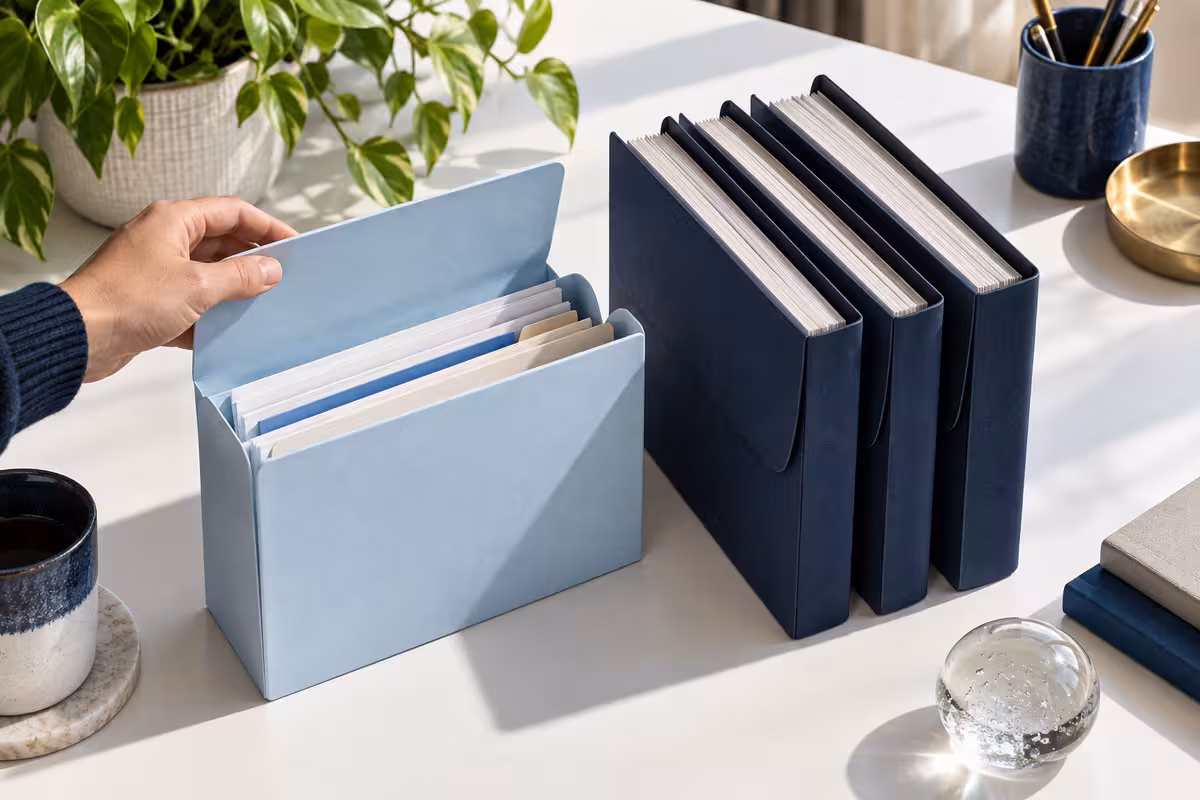 Financial records organized in a document box.